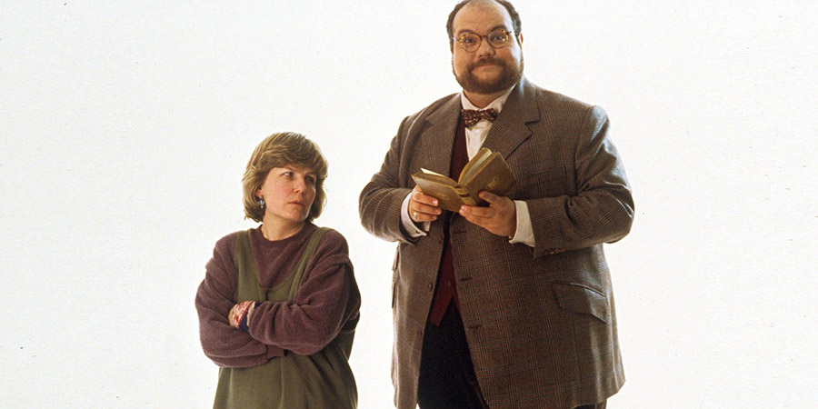 The Big One. Image shows from L to R: Deirdre 'Deddie' Tobert (Sandi Toksvig), James Howard (Mike McShane). Copyright: Hat Trick Productions. The Big One. Image shows from L to R: Deirdre 'Deddie' Tobert (Sandi Toksvig), James Howard (Mike McShane). Copyright: Hat Trick Productions.