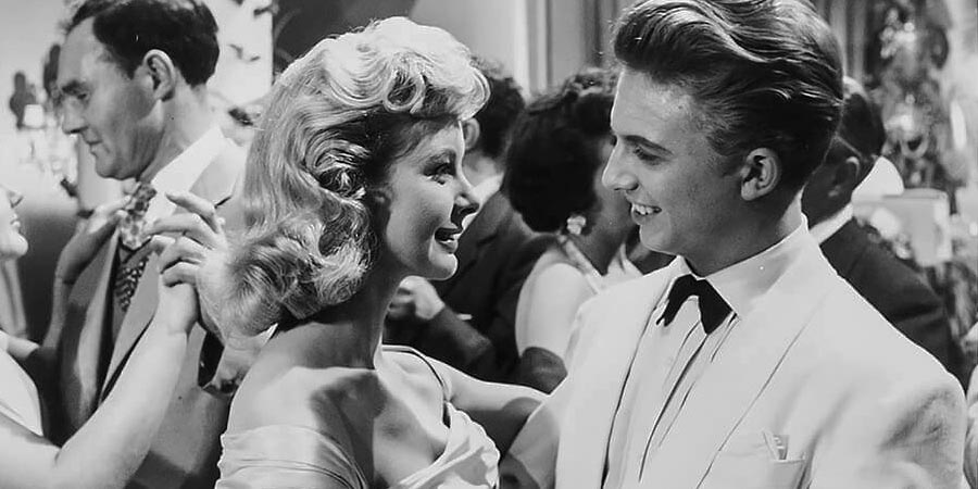 The Duke Wore Jeans. Image shows from L to R: June Laverick, Tommy Steele. Copyright: STUDIOCANAL. The Duke Wore Jeans. Image shows from L to R: June Laverick, Tommy Steele. Copyright: STUDIOCANAL.
