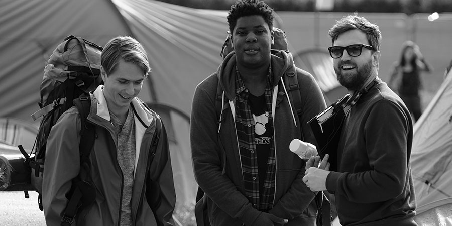 The Festival. Image shows from L to R: Nick (Joe Thomas), Shane (Hammed Animashaun), Iain Morris. Copyright: Fudge Park. The Festival. Image shows from L to R: Nick (Joe Thomas), Shane (Hammed Animashaun), Iain Morris. Copyright: Fudge Park.