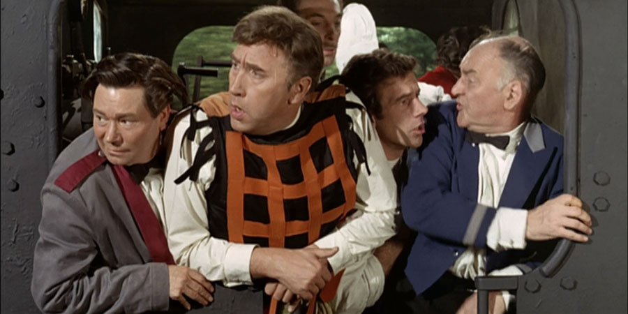The Great St. Trinian's Train Robbery. Image shows from L to R: Gilbert (Reg Varney), Alfred Askett (Frankie Howerd), Unknown, Unknown. Copyright: Braywild Limited. The Great St. Trinian's Train Robbery. Image shows from L to R: Gilbert (Reg Varney), Alfred Askett (Frankie Howerd), Unknown, Unknown. Copyright: Braywild Limited.