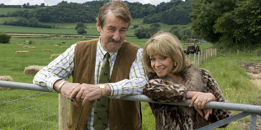 The Green Green Grass. Image shows from L to R: Boycie (John Challis), Marlene Boyce (Sue Holderness). Copyright: Shazam Productions. The Green Green Grass. Image shows from L to R: Boycie (John Challis), Marlene Boyce (Sue Holderness). Copyright: Shazam Productions.