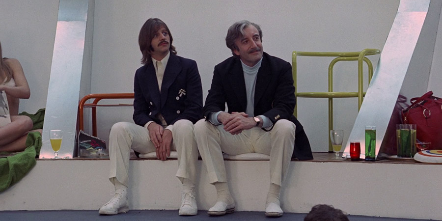 The Magic Christian. Image shows from L to R: Youngman Grand (Ringo Starr), Sir Guy Grand (Peter Sellers). Copyright: Universal Pictures. The Magic Christian. Image shows from L to R: Youngman Grand (Ringo Starr), Sir Guy Grand (Peter Sellers). Copyright: Universal Pictures.