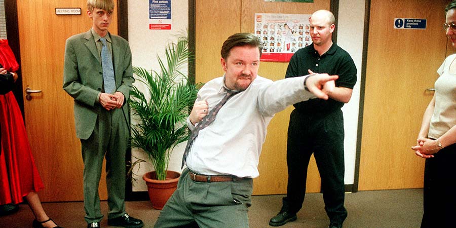 The Office. Image shows from L to R: Gareth Keenan (Mackenzie Crook), David Brent (Ricky Gervais), Unknown, Unknown. Copyright: BBC. The Office. Image shows from L to R: Gareth Keenan (Mackenzie Crook), David Brent (Ricky Gervais), Unknown, Unknown. Copyright: BBC.