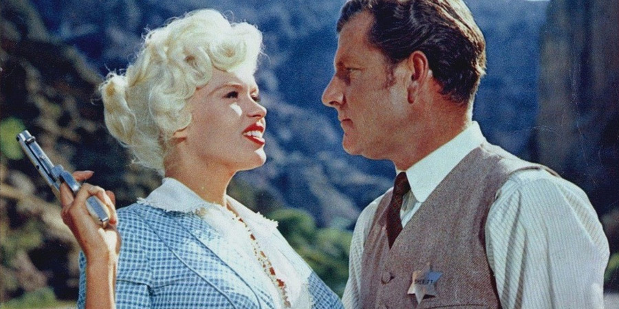 The Sheriff Of Fractured Jaw. Image shows from L to R: Kate (Jayne Mansfield), Jonathan Tibbs (Kenneth More). The Sheriff Of Fractured Jaw. Image shows from L to R: Kate (Jayne Mansfield), Jonathan Tibbs (Kenneth More).