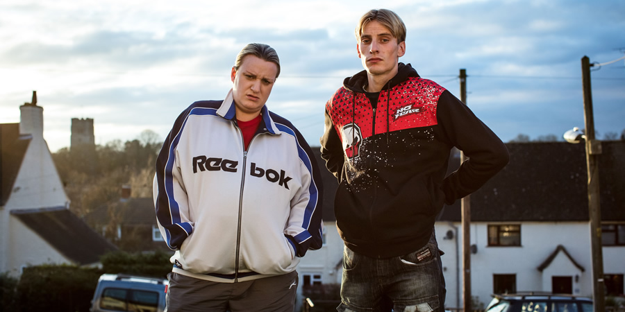 This Country. Image shows from L to R: Kerry Mucklowe (Daisy May Cooper), Lee 'Kurtan' Mucklowe (Charlie Cooper). Copyright: BBC. This Country. Image shows from L to R: Kerry Mucklowe (Daisy May Cooper), Lee 'Kurtan' Mucklowe (Charlie Cooper). Copyright: BBC.
