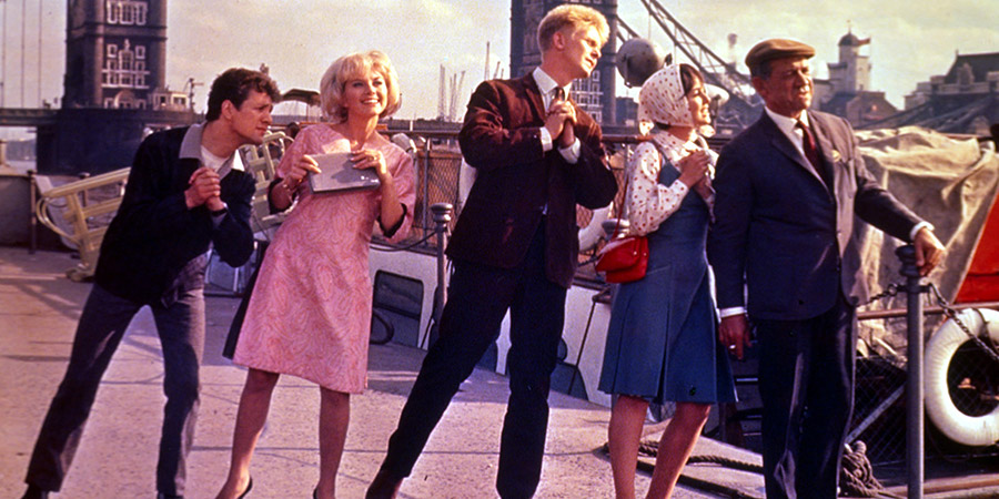 Three Hats For Lisa. Image shows from L to R: Sammy (Dave Nelson), Lisa Milan (Sophie Hardy), Johnny Howjego (Joe Brown), Flora (Una Stubbs), Sid Marks (Sid James). Copyright: Seven Hills Film Productions. Three Hats For Lisa. Image shows from L to R: Sammy (Dave Nelson), Lisa Milan (Sophie Hardy), Johnny Howjego (Joe Brown), Flora (Una Stubbs), Sid Marks (Sid James). Copyright: Seven Hills Film Productions.