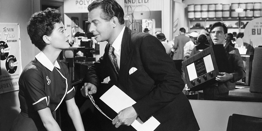 Trouble In Store. Image shows from L to R: Sally (Lana Morris), Gerald (Derek Bond), Norman (Norman Wisdom). Copyright: Two Cities Films. Trouble In Store. Image shows from L to R: Sally (Lana Morris), Gerald (Derek Bond), Norman (Norman Wisdom). Copyright: Two Cities Films.