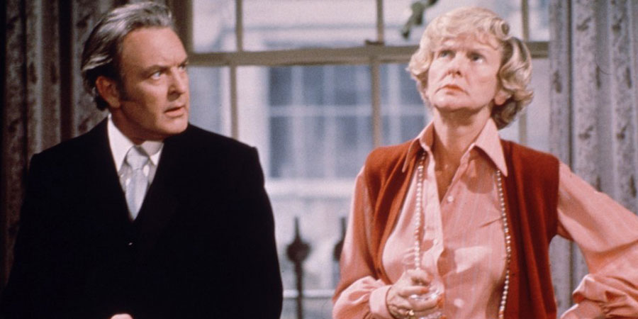 Two's Company. Image shows from L to R: Robert Hiller (Donald Sinden), Dorothy McNab (Elaine Stritch). Copyright: London Weekend Television. Two's Company. Image shows from L to R: Robert Hiller (Donald Sinden), Dorothy McNab (Elaine Stritch). Copyright: London Weekend Television.