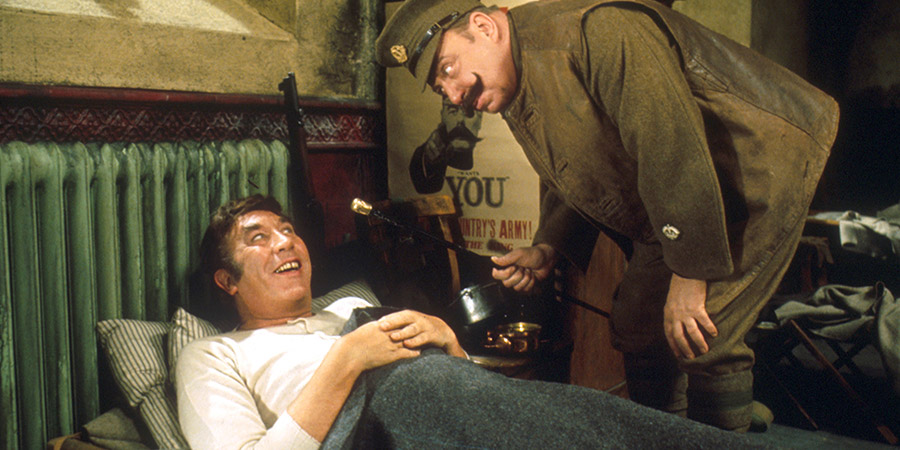 Up The Front. Image shows from L to R: Lurk (Frankie Howerd), Groping (Bill Fraser). Copyright: Associated London Films Limited / STUDIOCANAL. Up The Front. Image shows from L to R: Lurk (Frankie Howerd), Groping (Bill Fraser). Copyright: Associated London Films Limited / STUDIOCANAL.