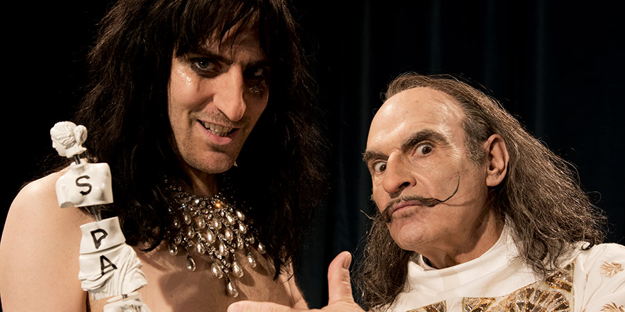Urban Myths: The Dali And The Cooper. Image shows from L to R: Alice Cooper (Noel Fielding), Salvador Dali (David Suchet). Urban Myths: The Dali And The Cooper. Image shows from L to R: Alice Cooper (Noel Fielding), Salvador Dali (David Suchet).