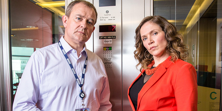W1A. Image shows from L to R: Ian Fletcher (Hugh Bonneville), Siobhan Sharpe (Jessica Hynes). Copyright: BBC. W1A. Image shows from L to R: Ian Fletcher (Hugh Bonneville), Siobhan Sharpe (Jessica Hynes). Copyright: BBC.