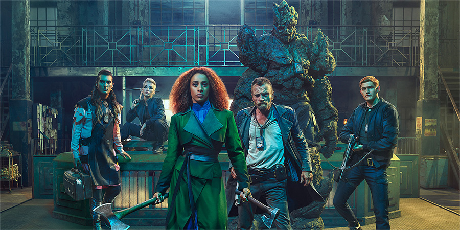The Watch. Image shows from L to R: Constable Cheery (Jo Eaton-Kent), Corporal Angua (Marama Corlett), Lady Sybil Ramkin (Lara Rossi), Sam Vimes (Richard Dormer), Sergeant Detritus, Constable Carrot (Adam Hugill). The Watch. Image shows from L to R: Constable Cheery (Jo Eaton-Kent), Corporal Angua (Marama Corlett), Lady Sybil Ramkin (Lara Rossi), Sam Vimes (Richard Dormer), Sergeant Detritus, Constable Carrot (Adam Hugill).