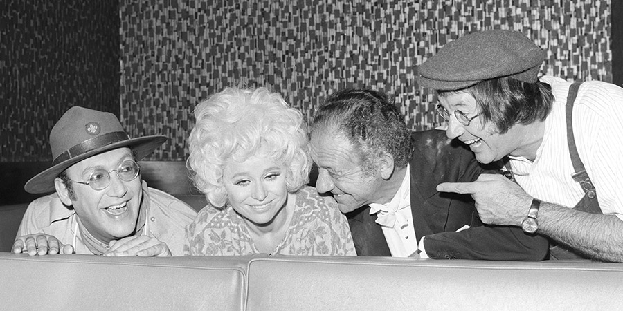What A Carry On!. Image shows from L to R: Bernard Bresslaw, Barbara Windsor, Sid James, Jack Douglas. Copyright: Associated Television / ITV. What A Carry On!. Image shows from L to R: Bernard Bresslaw, Barbara Windsor, Sid James, Jack Douglas. Copyright: Associated Television / ITV.
