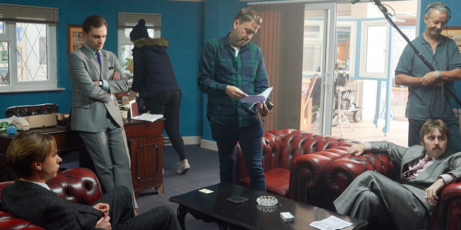 White Gold. Image shows from L to R: Martin Lavender (Joe Thomas), Vincent Swan (Ed Westwick), Damon Beesley, Brian Fitzpatrick (James Buckley). Copyright: Fudge Park. White Gold. Image shows from L to R: Martin Lavender (Joe Thomas), Vincent Swan (Ed Westwick), Damon Beesley, Brian Fitzpatrick (James Buckley). Copyright: Fudge Park.