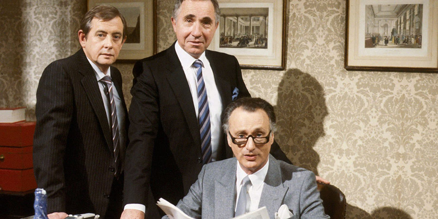 Yes Minister. Image shows from L to R: Bernard Woolley (Derek Fowlds), Sir Humphrey Appleby (Nigel Hawthorne), James Hacker (Paul Eddington). Copyright: BBC. Yes Minister. Image shows from L to R: Bernard Woolley (Derek Fowlds), Sir Humphrey Appleby (Nigel Hawthorne), James Hacker (Paul Eddington). Copyright: BBC.