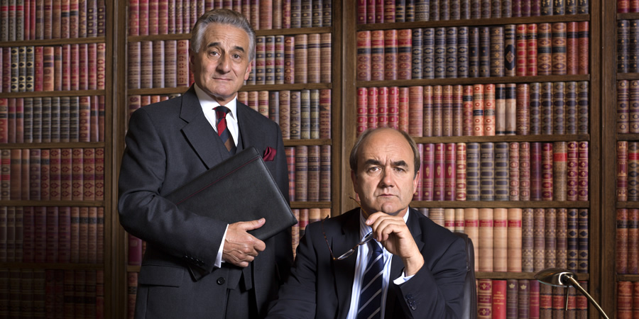 Yes, Prime Minister. Image shows from L to R: Sir Humphrey Appleby (Henry Goodman), Jim Hacker (David Haig). Copyright: BBC. Yes, Prime Minister. Image shows from L to R: Sir Humphrey Appleby (Henry Goodman), Jim Hacker (David Haig). Copyright: BBC.