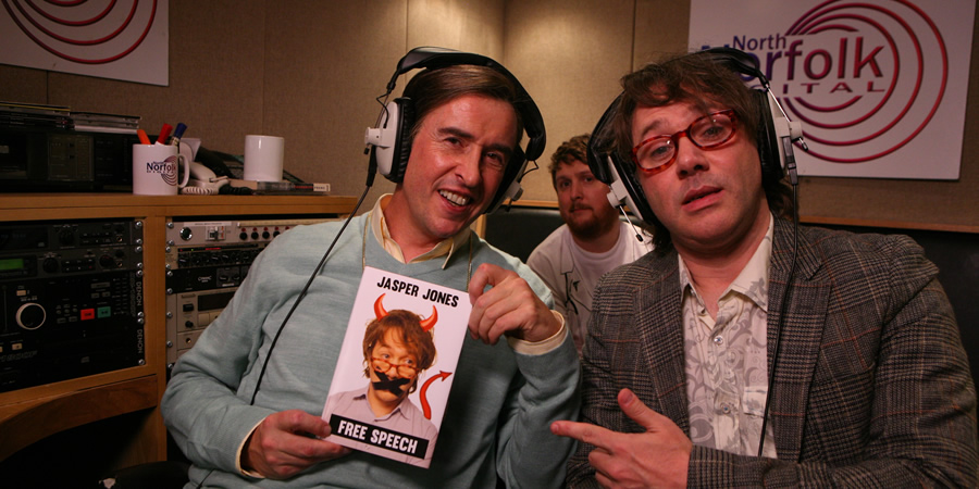 Mid Morning Matters With Alan Partridge. Image shows from L to R: Alan Partridge (Steve Coogan), Sidekick Simon (Tim Key), Jasper Jones (Reece Shearsmith). Copyright: Baby Cow Productions. Mid Morning Matters With Alan Partridge. Image shows from L to R: Alan Partridge (Steve Coogan), Sidekick Simon (Tim Key), Jasper Jones (Reece Shearsmith). Copyright: Baby Cow Productions.
