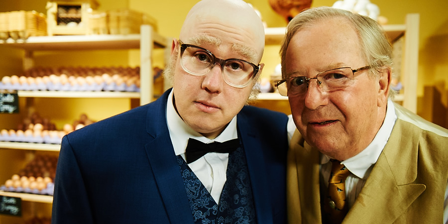 Bull. Image shows from L to R: Mr Richards (Matt Lucas), Egg Shop Owner (Tim Brooke-Taylor). Copyright: John Stanley Productions. Bull. Image shows from L to R: Mr Richards (Matt Lucas), Egg Shop Owner (Tim Brooke-Taylor). Copyright: John Stanley Productions.