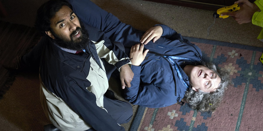Damned. Image shows from L to R: Nitin (Himesh Patel), Al Kavanagh (Alan Davies). Copyright: What Larks Productions. Damned. Image shows from L to R: Nitin (Himesh Patel), Al Kavanagh (Alan Davies). Copyright: What Larks Productions.