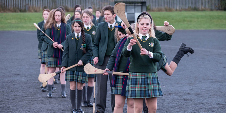 Derry Girls. Image shows from L to R: Saoirse-Monica Jackson, Dylan Llewellyn, Leah O'Rourke. Copyright: Hat Trick Productions. Derry Girls. Image shows from L to R: Saoirse-Monica Jackson, Dylan Llewellyn, Leah O'Rourke. Copyright: Hat Trick Productions.