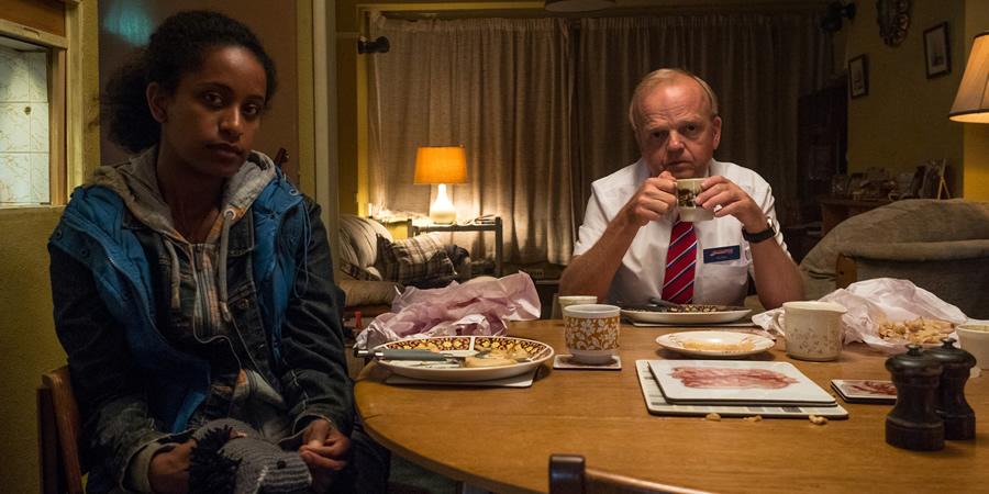 Don't Forget The Driver. Image shows from L to R: Rita (Luwam Teklizgi), Peter Green (Toby Jones). Don't Forget The Driver. Image shows from L to R: Rita (Luwam Teklizgi), Peter Green (Toby Jones).