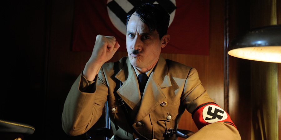 Drunk History. Adolf Hitler (Dustin Demri-Burns). Copyright: Tiger Aspect Productions. Drunk History. Adolf Hitler (Dustin Demri-Burns). Copyright: Tiger Aspect Productions.