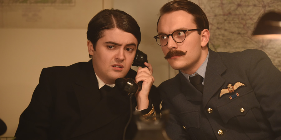 Drunk History. Image shows from L to R: Ewen Montagu (Dean Dobbs), Charles Cholmondeley (Jack Howard). Copyright: Tiger Aspect Productions. Drunk History. Image shows from L to R: Ewen Montagu (Dean Dobbs), Charles Cholmondeley (Jack Howard). Copyright: Tiger Aspect Productions.