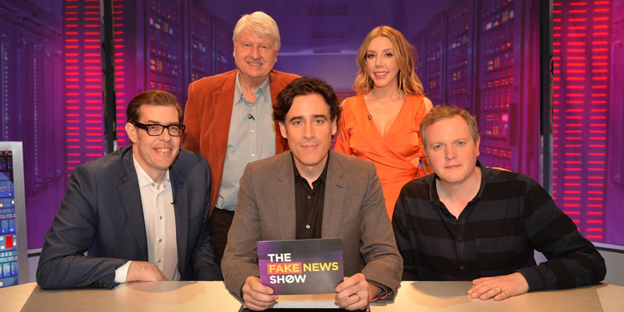 The Fake News Show. Image shows from L to R: Richard Osman, Stanley Johnson, Stephen Mangan, Katherine Ryan, Miles Jupp. Copyright: Hat Trick Productions. The Fake News Show. Image shows from L to R: Richard Osman, Stanley Johnson, Stephen Mangan, Katherine Ryan, Miles Jupp. Copyright: Hat Trick Productions.