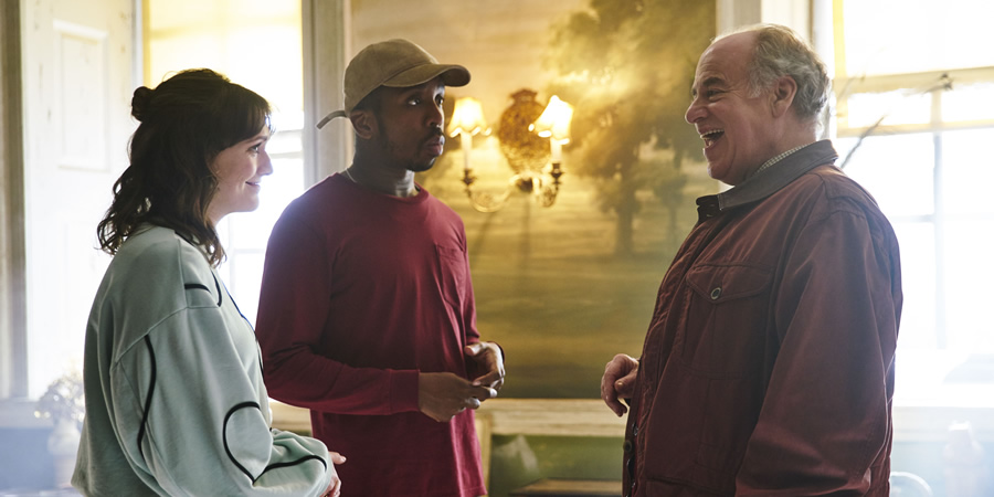 Ghosts. Image shows from L to R: Alison (Charlotte Ritchie), Mike (Kiell Smith-Bynoe), Barclay Beg-Chetwynde (Geoffrey McGivern). Copyright: Monumental Pictures. Ghosts. Image shows from L to R: Alison (Charlotte Ritchie), Mike (Kiell Smith-Bynoe), Barclay Beg-Chetwynde (Geoffrey McGivern). Copyright: Monumental Pictures.