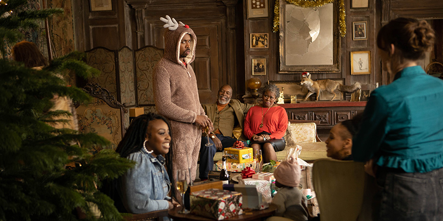 Ghosts. Image shows from L to R: Angela (Samantha Pearl), Mike (Kiell Smith-Bynoe), Errol (Leon Herbert), Betty (Sutara Gayle), Leila (Timmika Ramsay), Alison (Charlotte Ritchie). Copyright: Monumental Pictures. Ghosts. Image shows from L to R: Angela (Samantha Pearl), Mike (Kiell Smith-Bynoe), Errol (Leon Herbert), Betty (Sutara Gayle), Leila (Timmika Ramsay), Alison (Charlotte Ritchie). Copyright: Monumental Pictures.