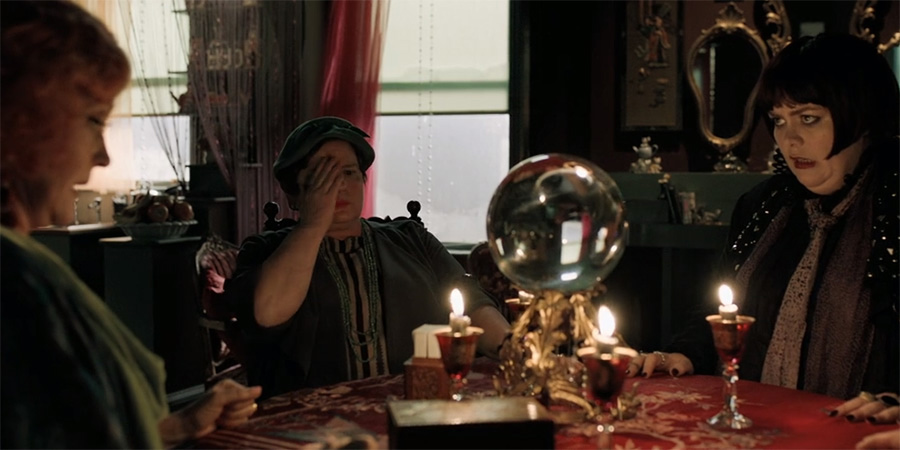 Good Omens. Image shows from L to R: Madame Tracy (Miranda Richardson), Brenda Ormorod (Jenny Galloway), Julia Petley (Jayde Adams). Good Omens. Image shows from L to R: Madame Tracy (Miranda Richardson), Brenda Ormorod (Jenny Galloway), Julia Petley (Jayde Adams).