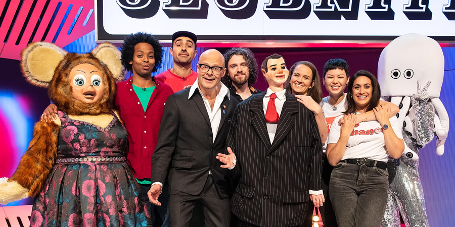 Harry Hill's ClubNite. Image shows from L to R: Mo Omar, Jamie Demetriou, Harry Hill, Alfie Brown, Zoe Coombs Marr, Anna Leong Brophy, Emily Lloyd Saini. Copyright: Nit TV. Harry Hill's ClubNite. Image shows from L to R: Mo Omar, Jamie Demetriou, Harry Hill, Alfie Brown, Zoe Coombs Marr, Anna Leong Brophy, Emily Lloyd Saini. Copyright: Nit TV.