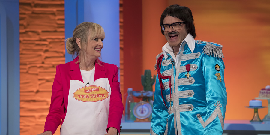 Harry Hill's Tea Time. Image shows from L to R: Lesley Hornby, Harry Hill. Copyright: Nit TV. Harry Hill's Tea Time. Image shows from L to R: Lesley Hornby, Harry Hill. Copyright: Nit TV.