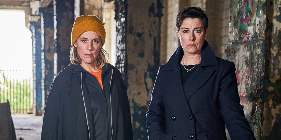 Hitmen. Image shows from L to R: Jamie (Mel Giedroyc), Fran (Sue Perkins). Copyright: Tiger Aspect Productions. Hitmen. Image shows from L to R: Jamie (Mel Giedroyc), Fran (Sue Perkins). Copyright: Tiger Aspect Productions.