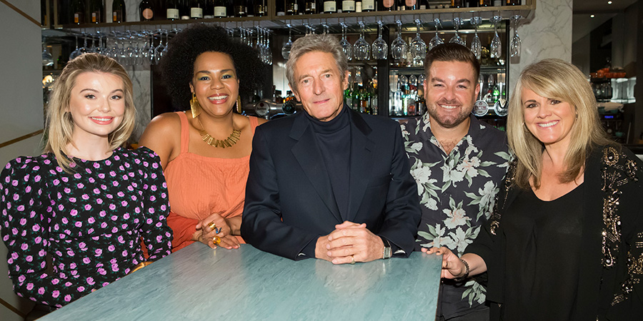 I'll Get This. Image shows from L to R: Georgia Toffolo, Desiree Burch, Nigel Havers, Alex Brooker, Sally Lindsay. Copyright: 12 Yard Productions. I'll Get This. Image shows from L to R: Georgia Toffolo, Desiree Burch, Nigel Havers, Alex Brooker, Sally Lindsay. Copyright: 12 Yard Productions.