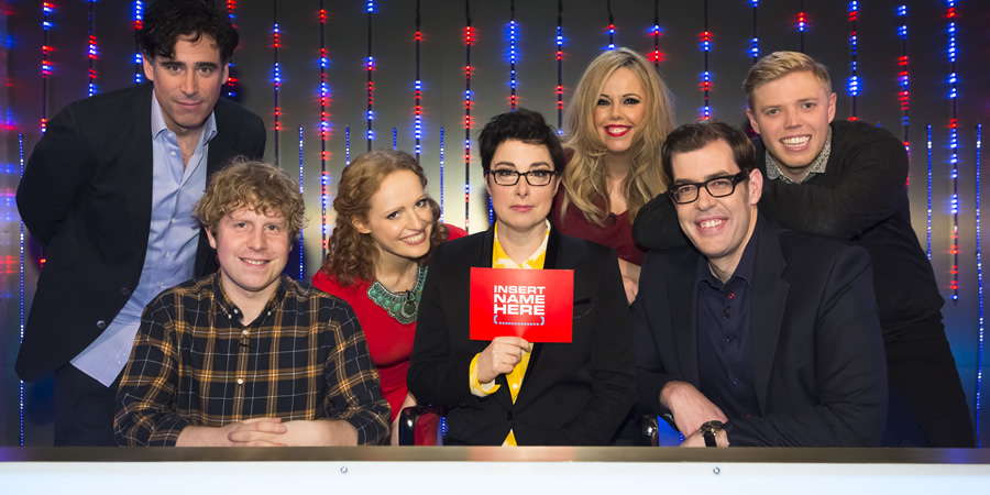 Insert Name Here. Image shows from L to R: Stephen Mangan, Josh Widdicombe, Kate Williams, Sue Perkins, Roisin Conaty, Richard Osman, Rob Beckett. Copyright: 12 Yard Productions / Black Dog Television. Insert Name Here. Image shows from L to R: Stephen Mangan, Josh Widdicombe, Kate Williams, Sue Perkins, Roisin Conaty, Richard Osman, Rob Beckett. Copyright: 12 Yard Productions / Black Dog Television.