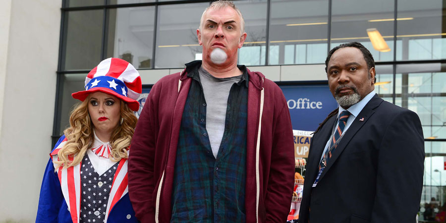 Man Down. Image shows from L to R: Jo (Roisin Conaty), Dan (Greg Davies), US Official (Reginald D Hunter). Copyright: Avalon Television. Man Down. Image shows from L to R: Jo (Roisin Conaty), Dan (Greg Davies), US Official (Reginald D Hunter). Copyright: Avalon Television.