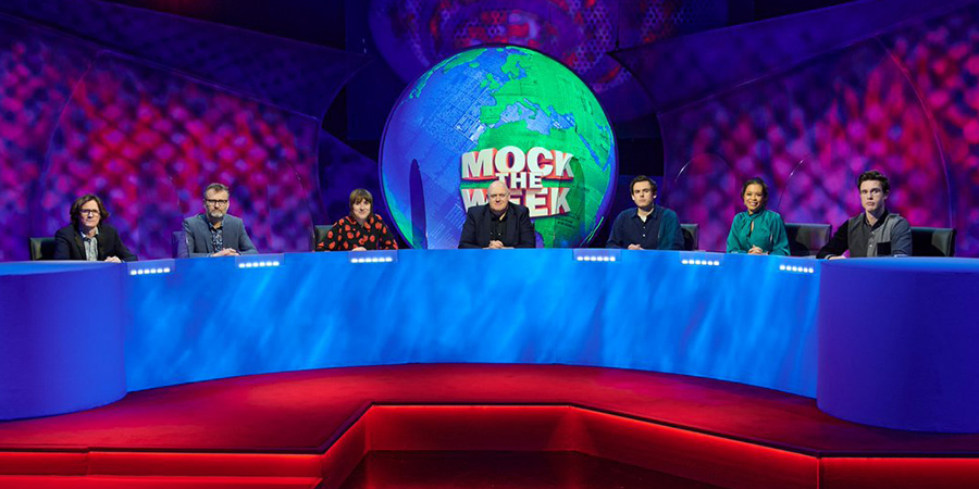 Mock The Week. Image shows from L to R: Ed Byrne, Hugh Dennis, Maisie Adam, Dara O Briain, Rhys James, Ria Lina, Ed Byrne. Copyright: Angst Productions. Mock The Week. Image shows from L to R: Ed Byrne, Hugh Dennis, Maisie Adam, Dara O Briain, Rhys James, Ria Lina, Ed Byrne. Copyright: Angst Productions.