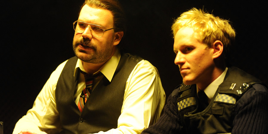 Murder In Successville. Image shows from L to R: DI Sleet (Tom Davis), Jamie Laing. Copyright: Tiger Aspect Productions. Murder In Successville. Image shows from L to R: DI Sleet (Tom Davis), Jamie Laing. Copyright: Tiger Aspect Productions.