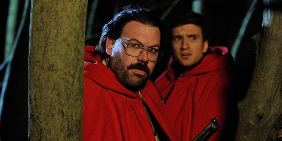 Murder In Successville. Image shows from L to R: DI Sleet (Tom Davis), Greg James. Copyright: Tiger Aspect Productions. Murder In Successville. Image shows from L to R: DI Sleet (Tom Davis), Greg James. Copyright: Tiger Aspect Productions.
