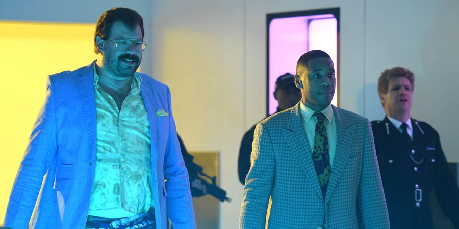Murder In Successville. Image shows from L to R: DI Sleet (Tom Davis), Reggie Yates, Gordon Ramsay (Liam Hourican). Murder In Successville. Image shows from L to R: DI Sleet (Tom Davis), Reggie Yates, Gordon Ramsay (Liam Hourican).