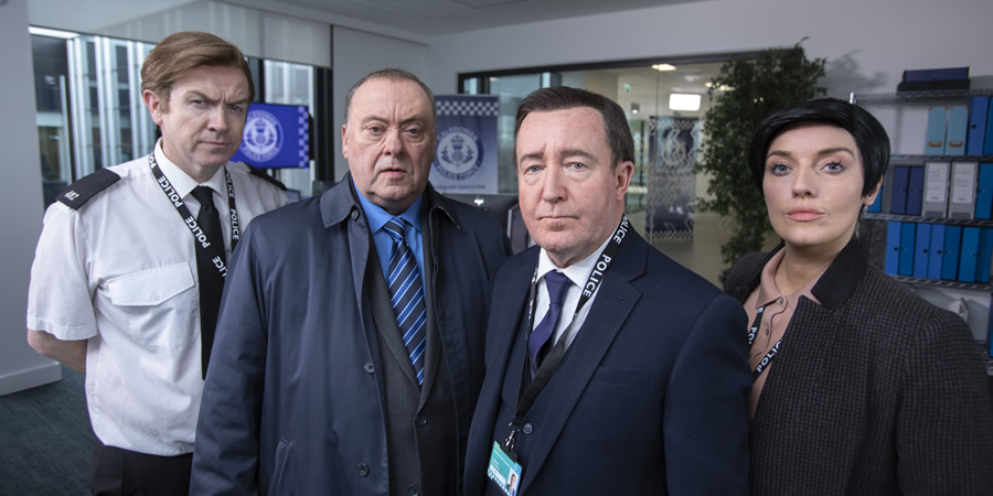 Mark Cox as a senior uniformed officer, Alex Norton as Taggart's DI Burke, Jonathan Watson as Line of Duty's DS Steve Arnott, Joy McAvoy as Line of Duty's DI Kate Fleming. Image shows from L to R: Mark Cox, Alex Norton, Jonathan Watson, Joy McAvoy. Mark Cox as a senior uniformed officer, Alex Norton as Taggart's DI Burke, Jonathan Watson as Line of Duty's DS Steve Arnott, Joy McAvoy as Line of Duty's DI Kate Fleming. Image shows from L to R: Mark Cox, Alex Norton, Jonathan Watson, Joy McAvoy.