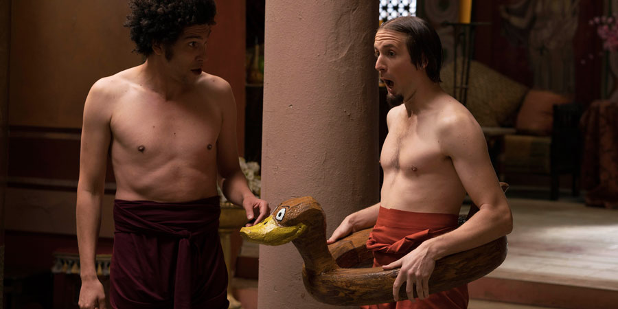 Plebs. Image shows from L to R: Stylax (Joel Fry), Aurelius (Tom Basden). Copyright: RISE Films. Plebs. Image shows from L to R: Stylax (Joel Fry), Aurelius (Tom Basden). Copyright: RISE Films.