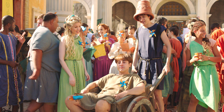 Plebs. Image shows from L to R: Diana (Rachel Parris), Grumio (Ryan Sampson), Marcus (Tom Rosenthal). Copyright: RISE Films. Plebs. Image shows from L to R: Diana (Rachel Parris), Grumio (Ryan Sampson), Marcus (Tom Rosenthal). Copyright: RISE Films.