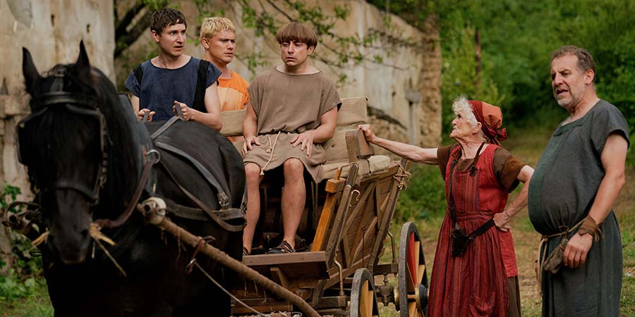Plebs. Image shows from L to R: Marcus (Tom Rosenthal), Jason (Jon Pointing), Grumio (Ryan Sampson), Nanna (Paola Dionisotti), Atlas (Nigel Lindsay). Copyright: RISE Films. Plebs. Image shows from L to R: Marcus (Tom Rosenthal), Jason (Jon Pointing), Grumio (Ryan Sampson), Nanna (Paola Dionisotti), Atlas (Nigel Lindsay). Copyright: RISE Films.