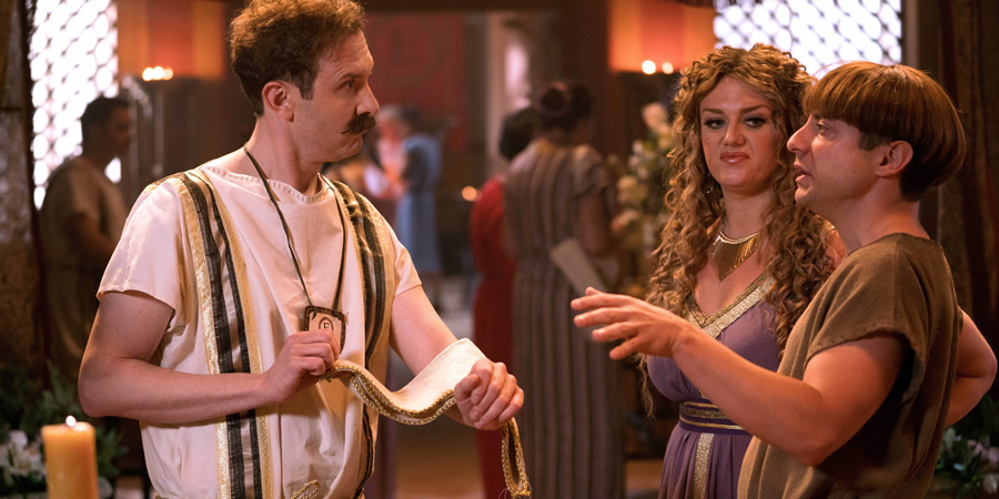 Plebs. Image shows from L to R: Esquilinus (Tim Downie), Phoebe (Faye McKeever), Grumio (Ryan Sampson). Copyright: RISE Films. Plebs. Image shows from L to R: Esquilinus (Tim Downie), Phoebe (Faye McKeever), Grumio (Ryan Sampson). Copyright: RISE Films.