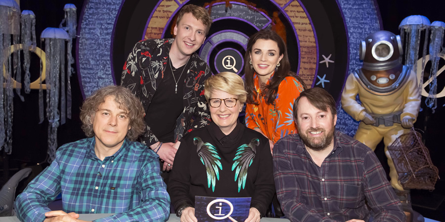 QI. Image shows from L to R: Alan Davies, Joe Lycett, Sandi Toksvig, Aisling Bea, David Mitchell. Copyright: TalkbackThames. QI. Image shows from L to R: Alan Davies, Joe Lycett, Sandi Toksvig, Aisling Bea, David Mitchell. Copyright: TalkbackThames.