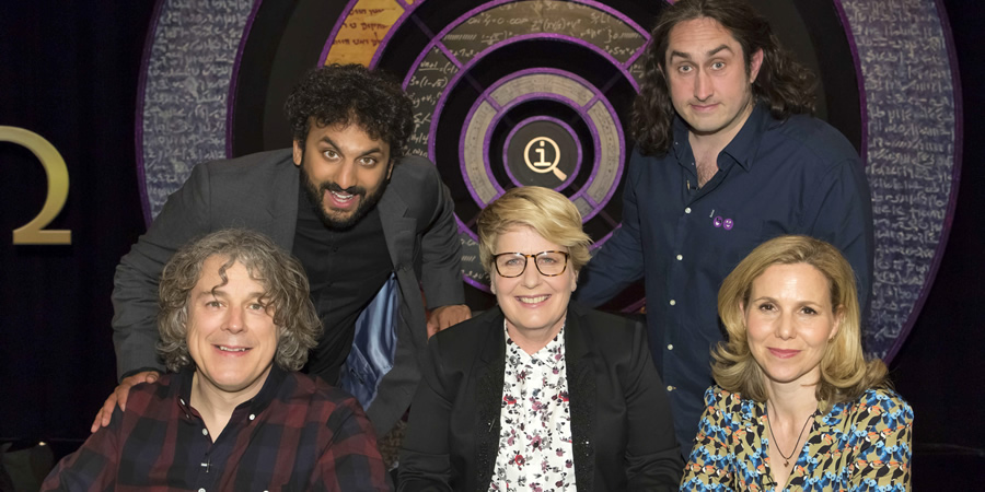 QI. Image shows from L to R: Alan Davies, Nish Kumar, Sandi Toksvig, Ross Noble, Sally Phillips. Copyright: TalkbackThames. QI. Image shows from L to R: Alan Davies, Nish Kumar, Sandi Toksvig, Ross Noble, Sally Phillips. Copyright: TalkbackThames.