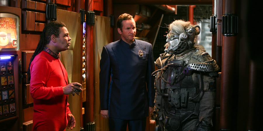 Red Dwarf. Image shows from L to R: Lister (Craig Charles), Rimmer (Chris Barrie), Hogey the Roguey (Richard O'Callaghan). Copyright: UKTV. Red Dwarf. Image shows from L to R: Lister (Craig Charles), Rimmer (Chris Barrie), Hogey the Roguey (Richard O'Callaghan). Copyright: UKTV.