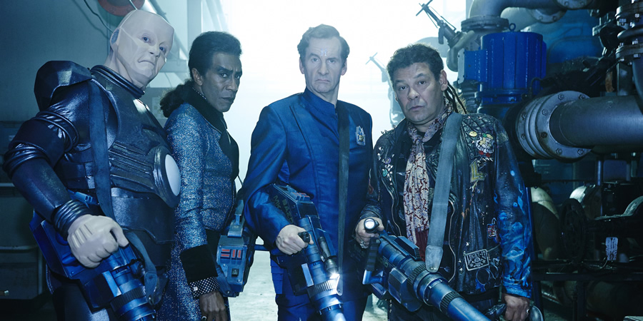 Red Dwarf. Image shows from L to R: Kryten (Robert Llewellyn), Cat (Danny John-Jules), Rimmer (Chris Barrie), Lister (Craig Charles). Red Dwarf. Image shows from L to R: Kryten (Robert Llewellyn), Cat (Danny John-Jules), Rimmer (Chris Barrie), Lister (Craig Charles).